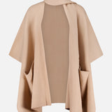 The WHITE + WARREN Cashmere Blend Poncho with Attached Scarf showcases a luxurious wool-cashmere blend in beige, designed with an open front, two spacious front pockets, and a high folded neckline, all displayed on a plain white background—an ideal women’s gift.