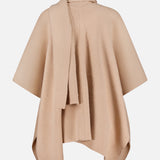The WHITE + WARREN Cashmere Blend Poncho with Attached Scarf features a draped, asymmetrical design in beige and is displayed on a white background—making it an elegant women’s gift for any occasion.