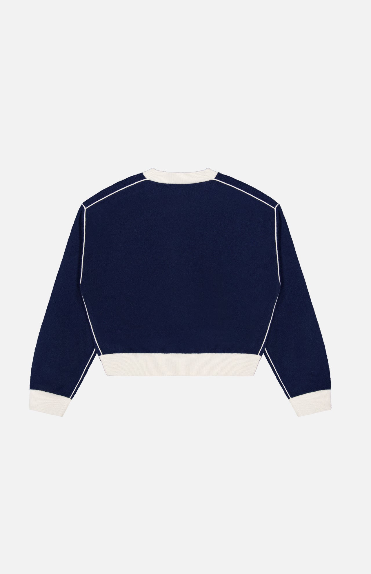 The Cashmere Blend Relaxed Crewneck Sweater by WHITE + WARREN is shown laid flat with the back facing up against a plain white background. This navy blue sweater features long sleeves, a crew neckline, and contrasting white cuffs, hem, collar, and piping details.