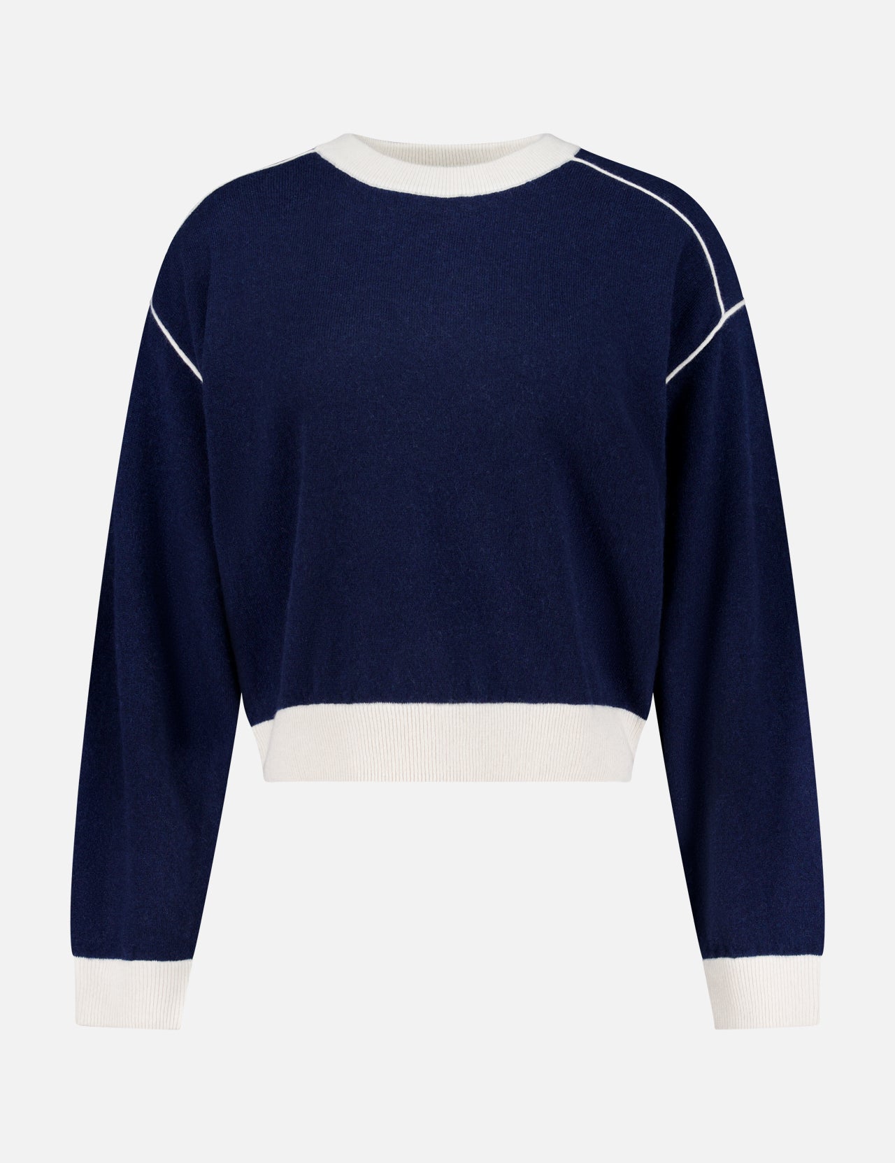 The Cashmere Blend Relaxed Crewneck Sweater by WHITE + WARREN is a navy blue, long-sleeve crew neck crafted from a wool-cashmere blend, featuring white ribbed cuffs, hem, and collar with white piping along the shoulders, shown against a plain white background.