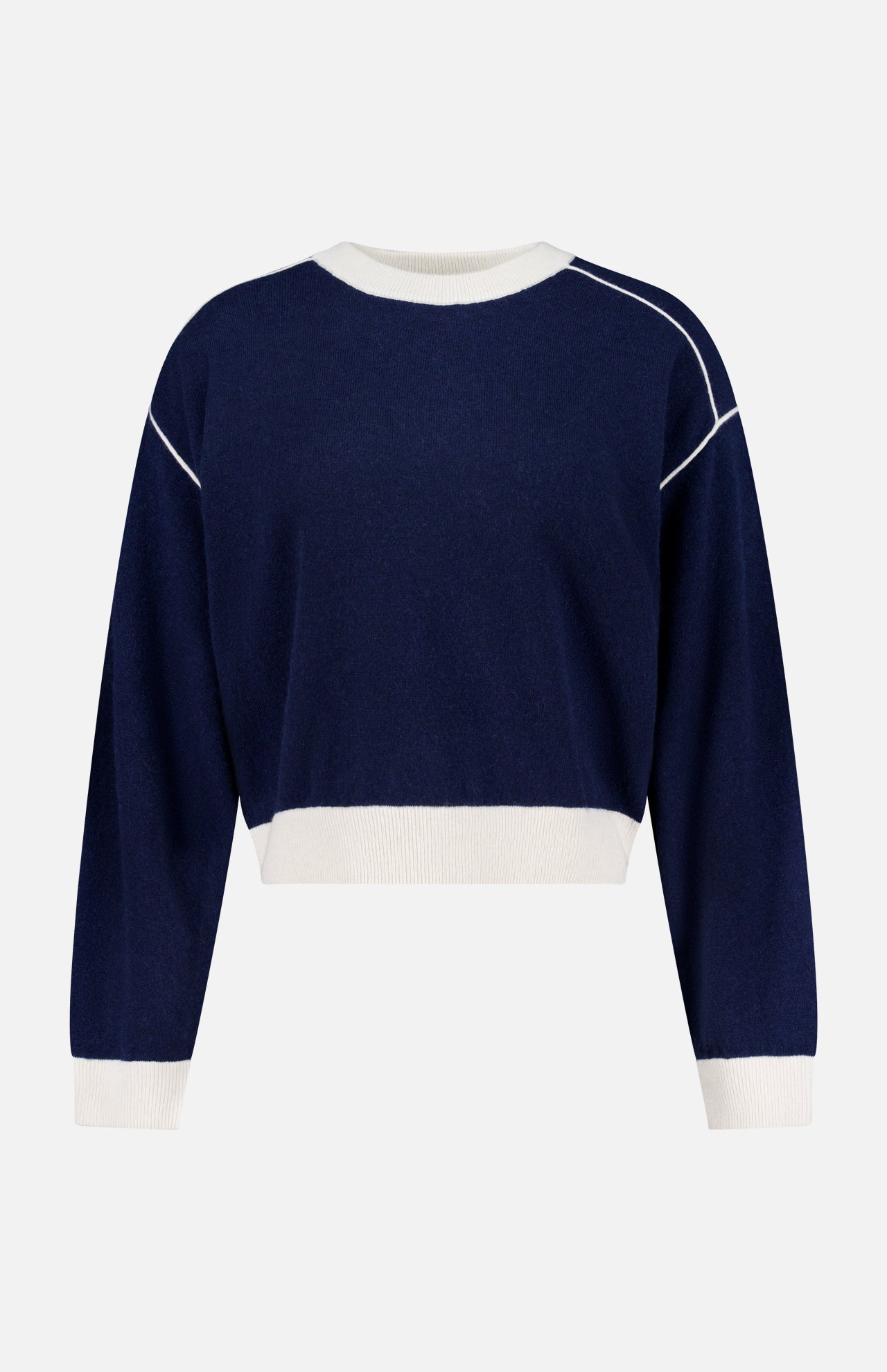 The Cashmere Blend Relaxed Crewneck Sweater by WHITE + WARREN is a navy blue, long-sleeve crew neck crafted from a wool-cashmere blend, featuring white ribbed cuffs, hem, and collar with white piping along the shoulders, shown against a plain white background.