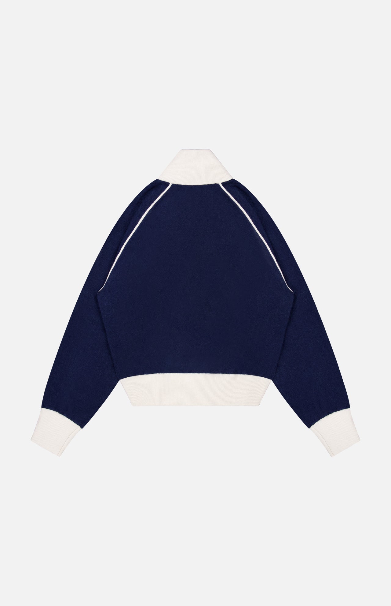 The Cashmere Blend Track Jacket by WHITE + WARREN, featuring a navy blue design with contrasting white cuffs, hem, and collar in the style of a classic knit track jacket, is displayed from the back against a plain white background.