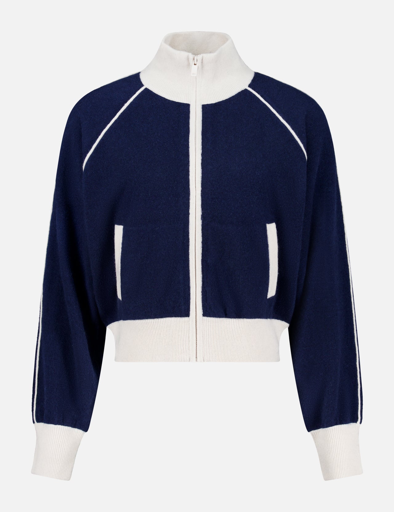 The WHITE + WARREN Cashmere Blend Track Jacket is shown on a plain background, featuring a navy design with white trim, a high collar, white ribbed cuffs and hem, and distinctive white vertical stripes along the sleeves and pockets.