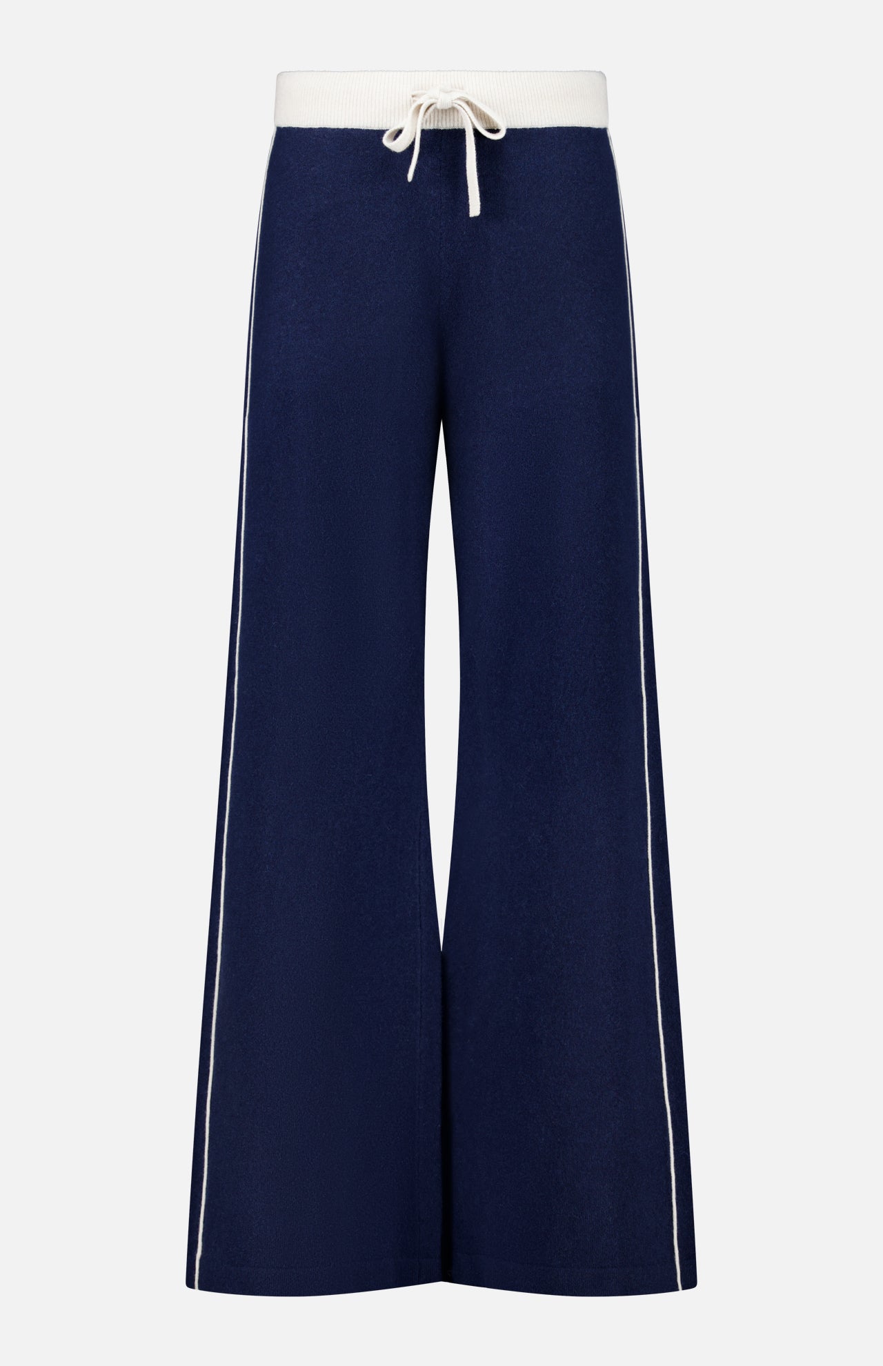 The Cashmere Blend Track Pants by WHITE + WARREN are wide-leg navy knit bottoms with a relaxed fit, designed with a white drawstring waist and vertical white stripes along the outer sides. Made from a soft, comfortable fabric blend including cashmere.