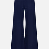 The Cashmere Blend Track Pants by WHITE + WARREN feature a wide-leg silhouette in navy with a high waist and a contrasting white drawstring waistband, displayed from the back against a plain white background.