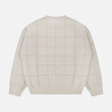 The Cashmere Blend Windowpane Sweater by WHITE + WARREN is shown flat with the back facing up. This cream-colored knit top features a subtle light beige windowpane grid pattern, long sleeves, and ribbed cuffs, hem, and neckline for a cozy finish.