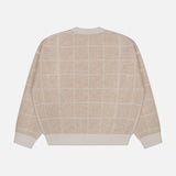 The WHITE + WARREN Cashmere Blend Windowpane Sweater, displayed flat against a white background, features a beige hue with a white grid pattern and is crafted from a cozy wool-cashmere blend with long sleeves and ribbed cuffs, collar, and hem.