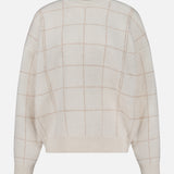 The WHITE + WARREN Cashmere Blend Windowpane Sweater is a cream-colored wool-cashmere blend featuring a light beige windowpane plaid pattern, long sleeves, and ribbed cuffs and hem. The sweater is shown laid flat against a white background.