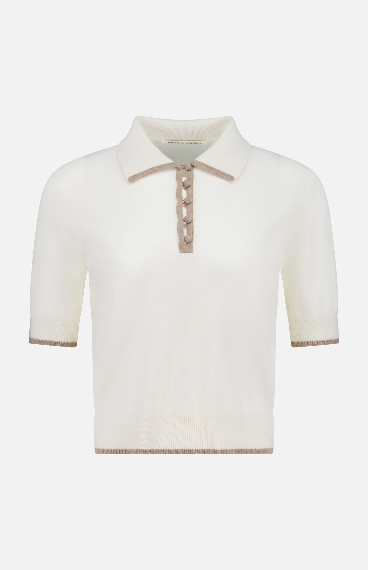 The WHITE + WARREN Cashmere Button Polo Shirt is a ladies’ cropped, short-sleeve off-white sweater with a beige collar, button placket, and trim on the sleeves and hem. It features a classic, minimalist design.