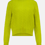 The WHITE + WARREN Cashmere Cable Crewneck Sweater, in a vibrant yellow-green hue inspired by citrus, features long sleeves, a crew neckline, and a slightly cropped high-low hem. The sweater is showcased against a plain white background.