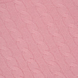 Close-up of a pink Cashmere Cable Crewneck Sweater with a visible WHITE + WARREN label in the top left corner, highlighting the soft texture of this luxurious cashmere piece.
