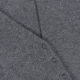 Close-up of the WHITE + WARREN Cashmere Deep V-neck Cardigan in gray. Four small buttons line a pointed seam, indicating this is a button-up cardigan. The fabric looks soft and slightly textured, highlighting the luxurious quality of its cashmere construction.