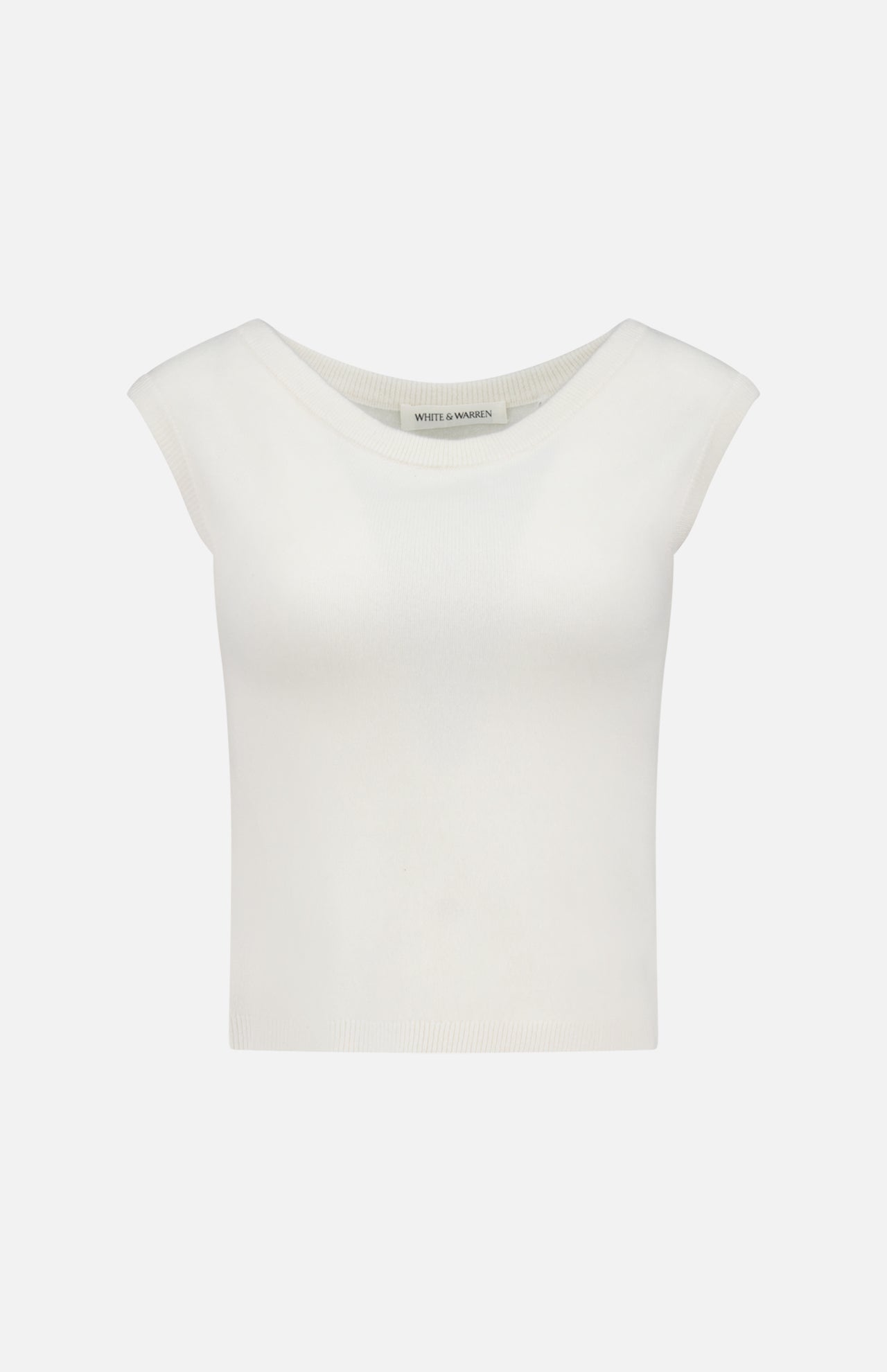 The WHITE + WARREN Cashmere Off Shoulder Top is a white, slim-fit, cropped knit with a wide round neckline and sleeveless design, shown against a plain light background.