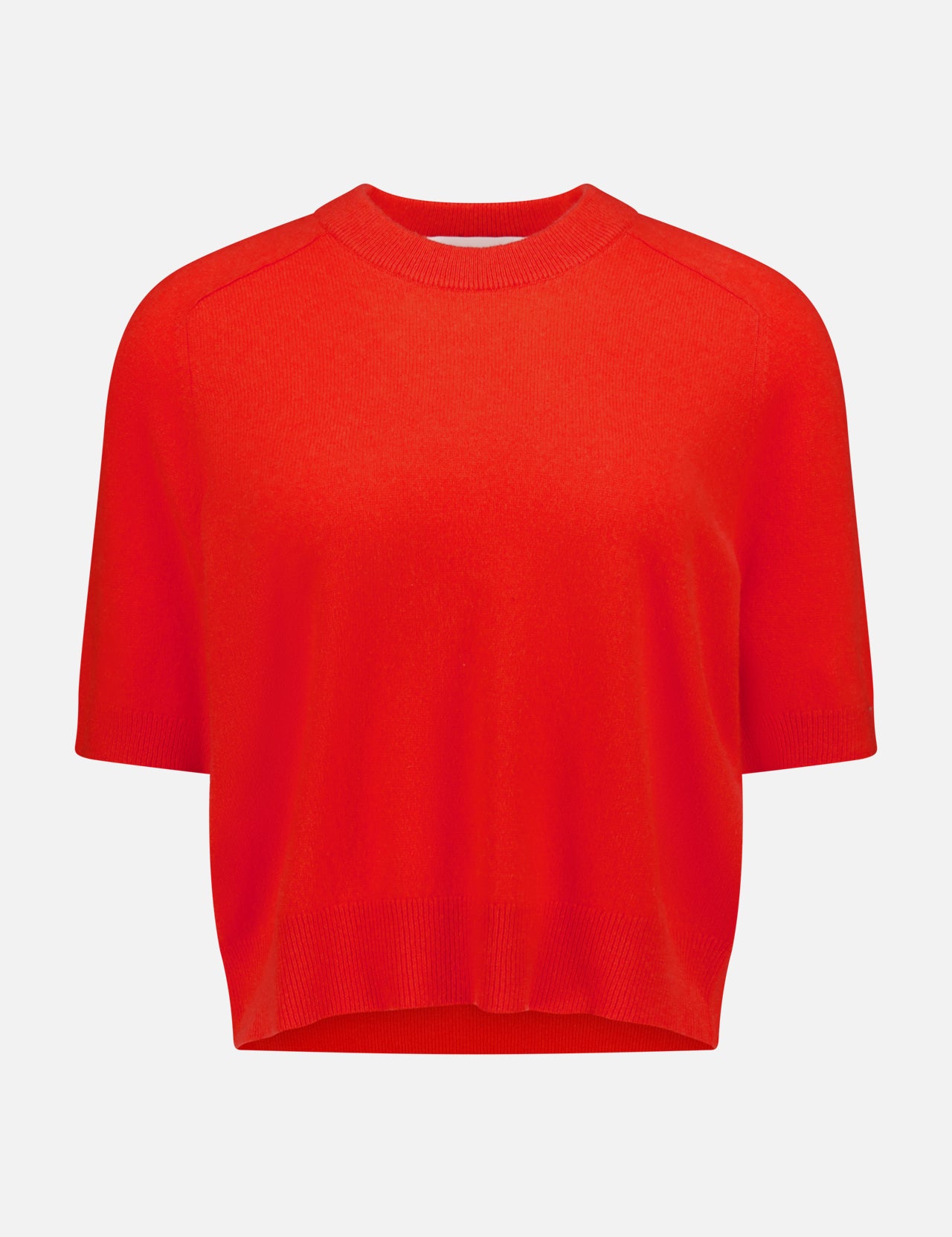 The WHITE + WARREN Cashmere Relaxed T-Shirt features a poppy red hue, short sleeves, a crew neckline, and ribbed hems in a relaxed fit, shown against a plain white background.