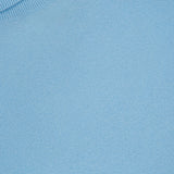 Close-up of the WHITE + WARREN Cashmere Rib Trim Easy Turtleneck Sweater in light blue, showcasing the ribbed neckline and the luxurious, soft cashmere knit texture.