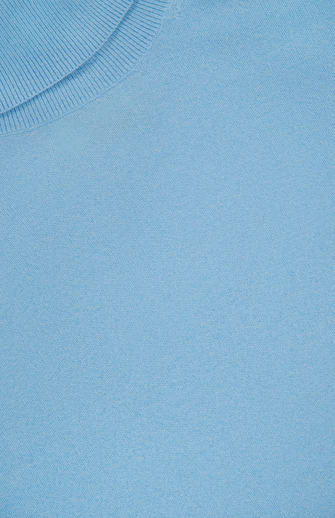 Close-up of the WHITE + WARREN Cashmere Rib Trim Easy Turtleneck Sweater in light blue, showcasing the ribbed neckline and the luxurious, soft cashmere knit texture.