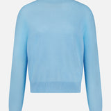 The WHITE + WARREN Cashmere Rib Trim Easy Turtleneck Sweater in light blue features long sleeves, a mock turtleneck, and ribbed cuffs and hem, displayed against a plain white background.