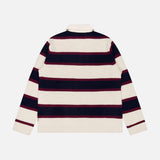 Back view of the WHITE + WARREN Cashmere Rugby Long Sleeve Polo Shirt, featuring wide horizontal stripes in cream, dark navy, and burgundy. Showcasing the rugby trend, this shirt has a classic collar and is laid flat against a plain white background.