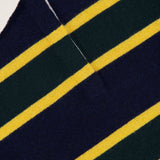 Close-up of the WHITE + WARREN Cashmere Rugby Long Sleeve Polo Shirt, featuring navy blue, green, and yellow horizontal stripes and a white rugby-style collar, with the WHITE + WARREN label visible.