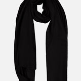 A WHITE + WARREN Cashmere Travel Wrap in black is loosely folded against a plain white background.