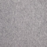 Close-up of the WHITE + WARREN Cashmere Travel Wrap in light grey, showcasing its soft, textured surface with subtle mottling and gentle variations in shading, reminiscent of a cozy blanket or luxurious cashmere. No distinct patterns or objects are visible.