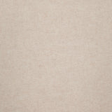 A close-up of the WHITE + WARREN Cashmere Travel Wrap showcases its plain, beige cashmere fabric with a subtle, fine texture. The surface appears smooth and uniform, featuring no visible patterns or designs.