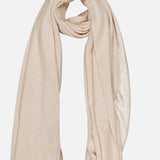 The WHITE + WARREN Cashmere Travel Wrap in light beige is displayed in a loose, circular fold against a plain white background.