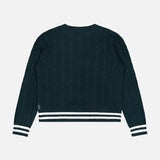 The WHITE + WARREN Cashmere Varsity Cable Crewneck Sweater is shown from the back against a plain white background, highlighting its dark green hue, classic cable knit design, and distinctive white and black striped ribbed cuffs and hem.