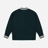 White + Warren Cashmere Varsity Cardigan in dark green with white stripe detail on the ribbed collar, cuffs, and hem.