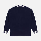 The WHITE + WARREN Cashmere Varsity Cardigan is shown from the back, featuring white and navy striped ribbed cuffs and collar in a classic, plain boyfriend-style design with no visible logos or patterns.