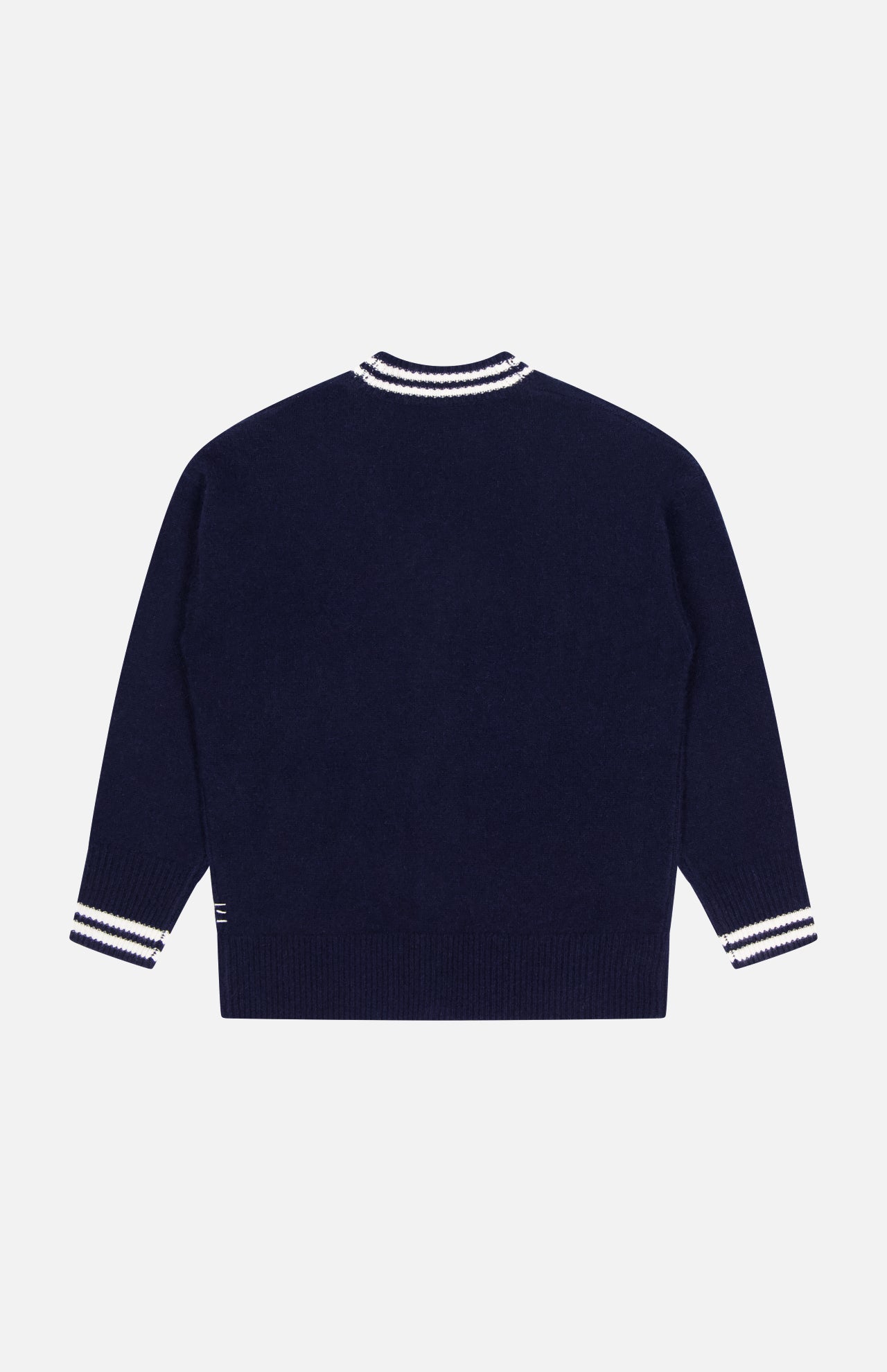 The WHITE + WARREN Cashmere Varsity Cardigan is shown from the back, featuring white and navy striped ribbed cuffs and collar in a classic, plain boyfriend-style design with no visible logos or patterns.
