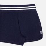 The WHITE + WARREN Cashmere Varsity Shorts feature a navy hue, white double stripe on the elastic waistband, and three small white lines near the hem. Only the right half is shown against a white background.