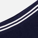 Close-up of WHITE + WARREN Cashmere Varsity Shorts in navy, with rounded edges and two parallel white stripes along the border, shown against a plain white background.