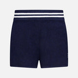 The WHITE + WARREN Cashmere Varsity Shorts feature a soft terry cloth build in navy with a white double-stripe elastic waist. These sporty shorts offer easy comfort and are shown against a plain white background.