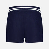 The WHITE + WARREN Cashmere Varsity Shorts, shown from the back on a white background, feature plush navy terry cloth and a blue-and-white striped elastic waistband for comfort and ease.