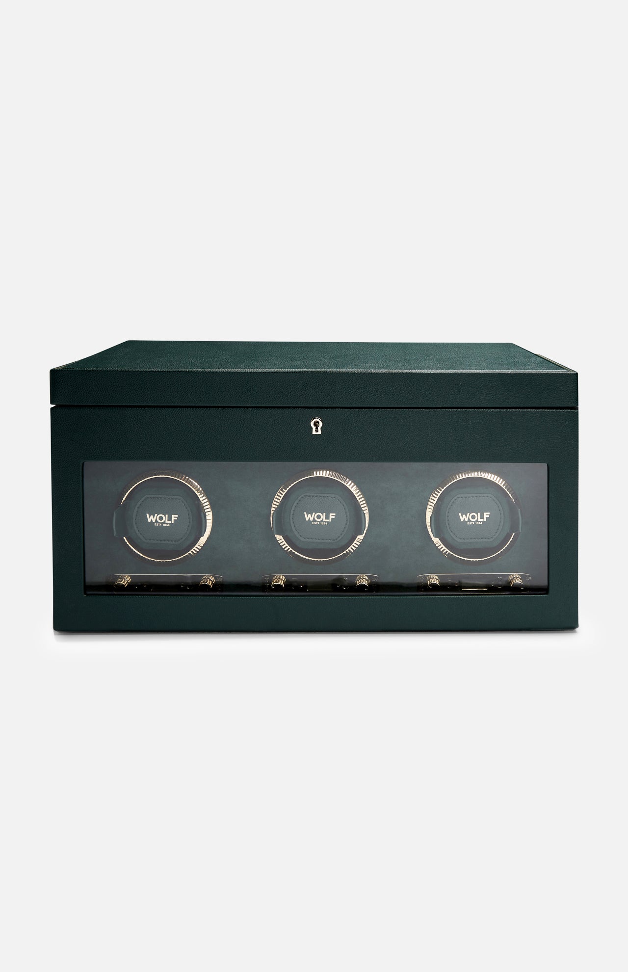 The WOLF British Racing Triple Watch Winder features a green rectangular design with a glass front that showcases three circular compartments, each marked with the WOLF logo. Crafted from premium vegan leather for an elegant and sustainable exterior, this watch winder is designed to wind automatic watches while offering sophisticated storage.