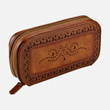 The WOLF Brogue 2 Piece Watch Zip Case features a brown leather exterior with decorative perforated patterns on the front, inspired by classic brogue collection designs. It has rounded edges, a gold zipper, and a smooth finish. The case is showcased against a plain white background.