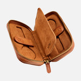 Introducing the WOLF Brogue 2 Piece Watch Zip Case—a brown leather watch case from the Brogue Collection. Featuring a zippered closure, a luxurious suede interior, and dedicated compartments with loops to securely store two watches or other small valuables, this case is the perfect choice for stylish and secure luxury watch storage.