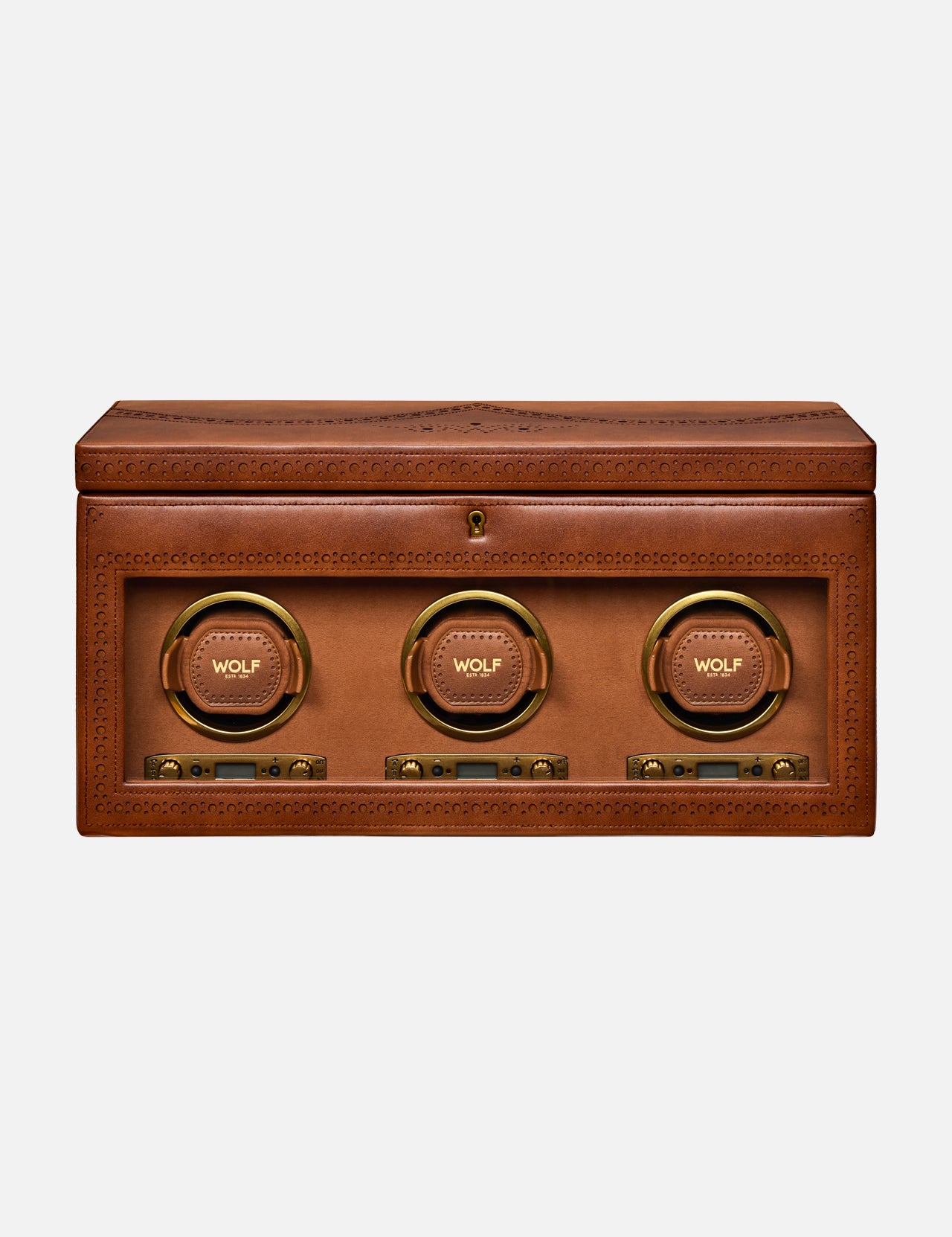 Introducing the Brogue Triple Winder with Storage by WOLF: a rectangular brown leather box adorned with detailed stitching, this luxury watch winder showcases three circular, gold-rimmed compartments labeled WOLF on the front—each equipped with control buttons below—making it an elegant solution for storing and displaying your finest timepieces.