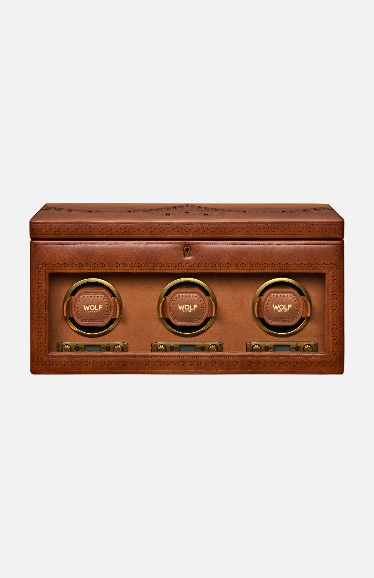 Introducing the Brogue Triple Winder with Storage by WOLF: a rectangular brown leather box adorned with detailed stitching, this luxury watch winder showcases three circular, gold-rimmed compartments labeled WOLF on the front—each equipped with control buttons below—making it an elegant solution for storing and displaying your finest timepieces.