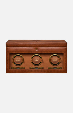Introducing the Brogue Triple Winder with Storage by WOLF: a rectangular brown leather box adorned with detailed stitching, this luxury watch winder showcases three circular, gold-rimmed compartments labeled WOLF on the front—each equipped with control buttons below—making it an elegant solution for storing and displaying your finest timepieces.