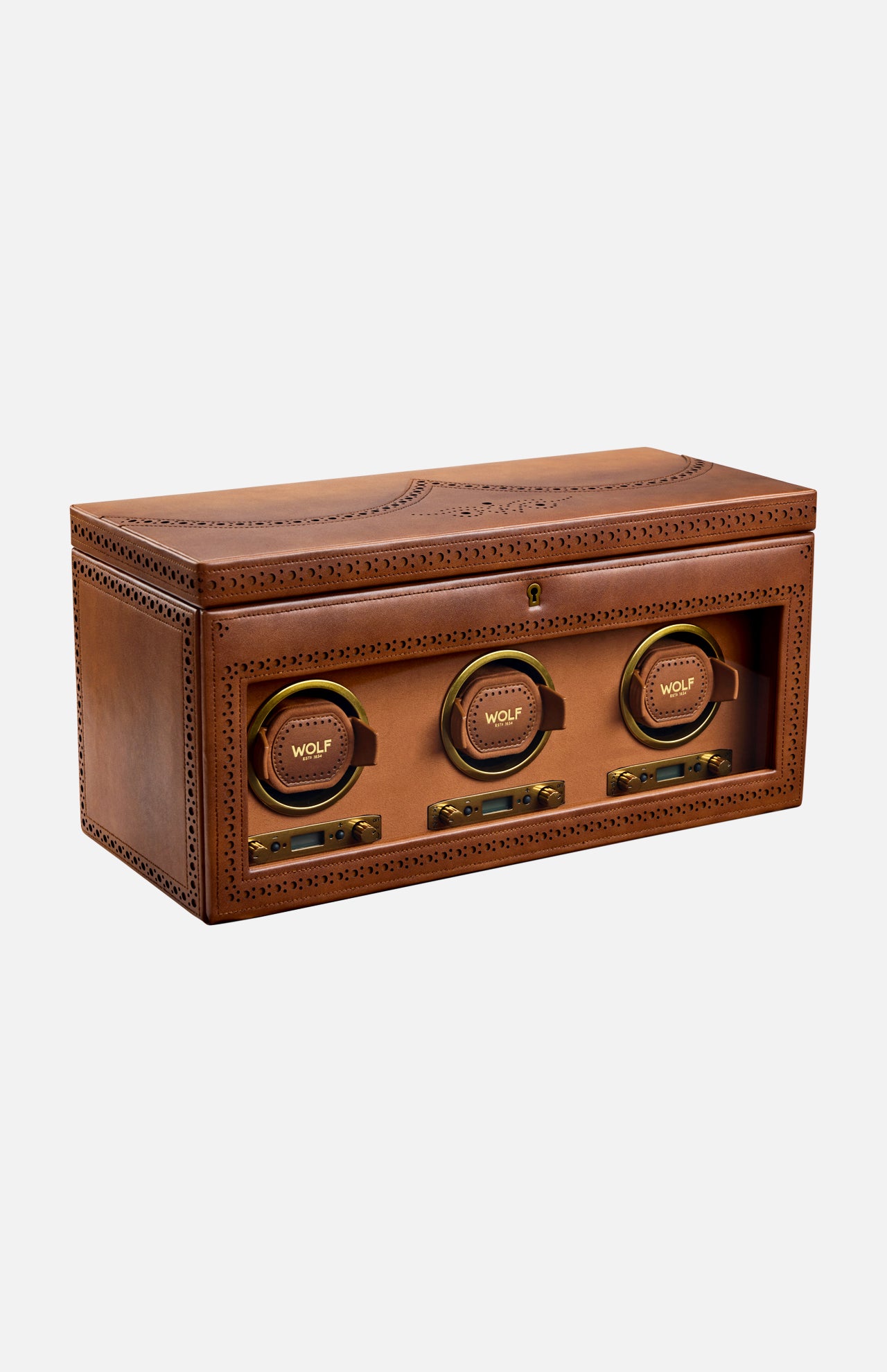 The WOLF Brogue Triple Winder with Storage is a brown leather luxury watch winder box featuring three circular slots, each labeled with the WOLF logo, decorative stitching, and a transparent front panel for elegant triple watch storage.