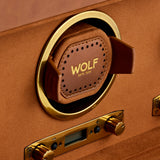 Close-up of the WOLF Brogue Triple Winder with Storage—a brown and gold luxury watch winder featuring a leather cushion and digital display, elegantly set inside a tan suede-lined case for refined watch storage.