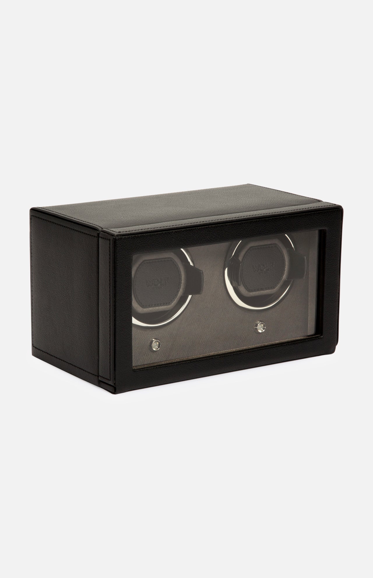 The WOLF Cub Double Winder with Cover is a black rectangular box crafted from premium vegan leather, featuring a glass front that displays two slots for watches inside. Showcasing a sleek, modern design, this luxury accessory blends sophisticated aesthetics with practical functionality and is positioned at an angle against a white background.