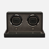 The WOLF Cub Double Winder with Cover, crafted from black vegan leather and featuring two circular slots along with silver accents, exemplifies luxury design against a plain white background.