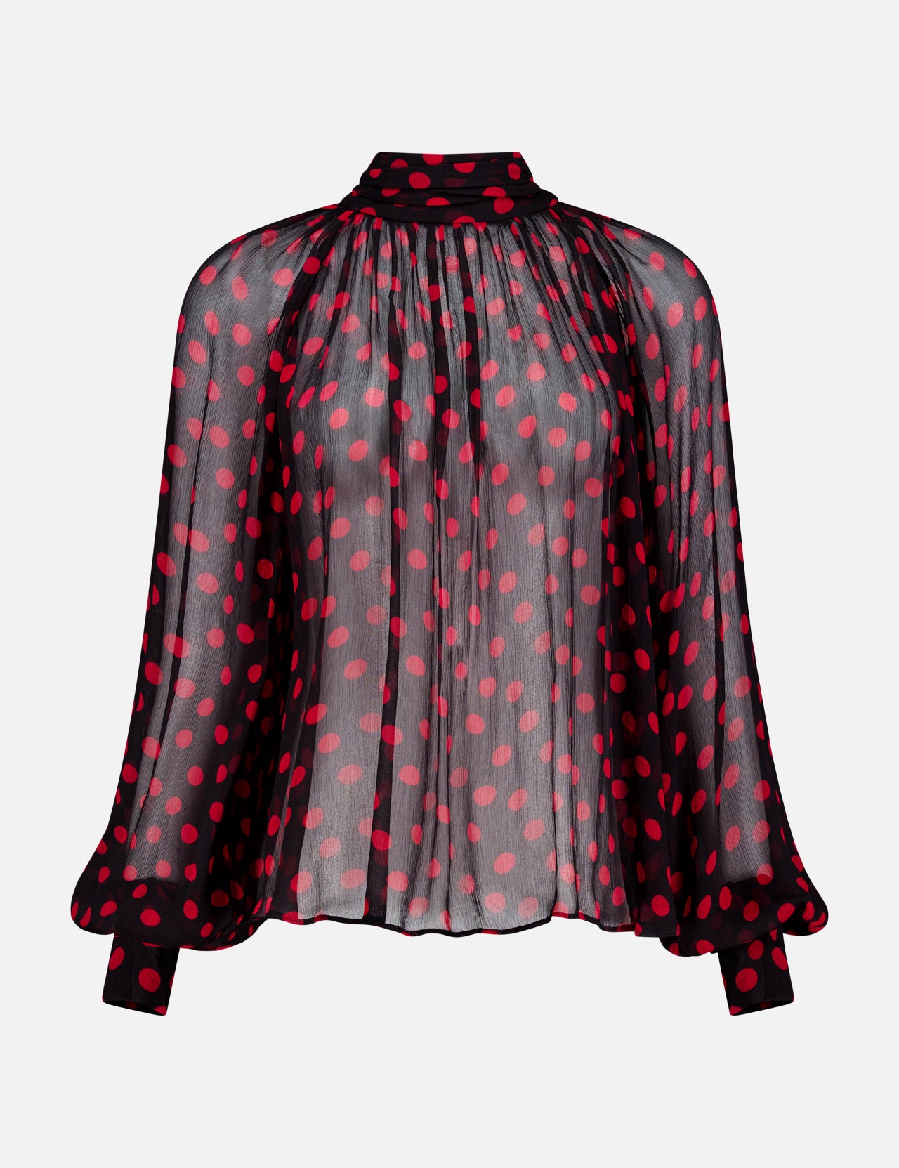 The Zenia Sheer Polka Dot Top by RONNY KOBO is a chic black blouse with long, wide sleeves, a gathered neckline, and bright red polka dots. It features solid black cuffs and collar accented with matching red dots.