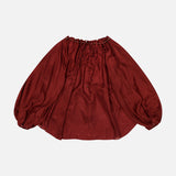 The ZIMMERMANN Aster Gathered Bead Blouse is a voluminous, off-the-shoulder merlot satin top with long sleeves and elasticated neckline and cuffs, shown laid flat on a white background.