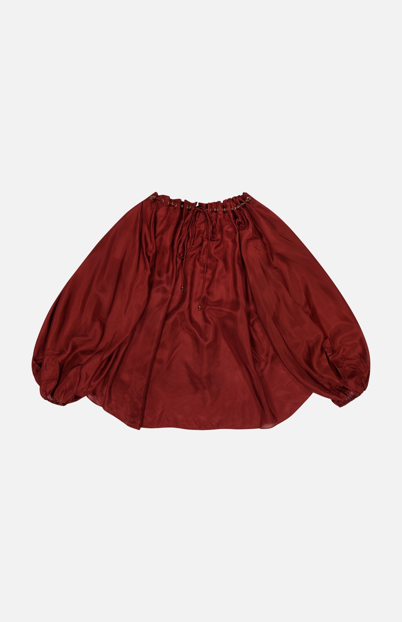 The ZIMMERMANN Aster Gathered Bead Blouse is a voluminous, off-the-shoulder merlot satin top with long sleeves and elasticated neckline and cuffs, shown laid flat on a white background.