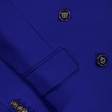 Close-up of a cobalt blue Zimmermann Clash Double Breasted Blazer with gold-tone buttons featuring a circular logo.