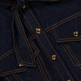 Close-up of deep blue denim fabric featuring orange stitching, metal buttons, flap pockets, and a tied belt at the waist, highlighting the classic corset details of the ZIMMERMANN Denim Corset Mini Dress.